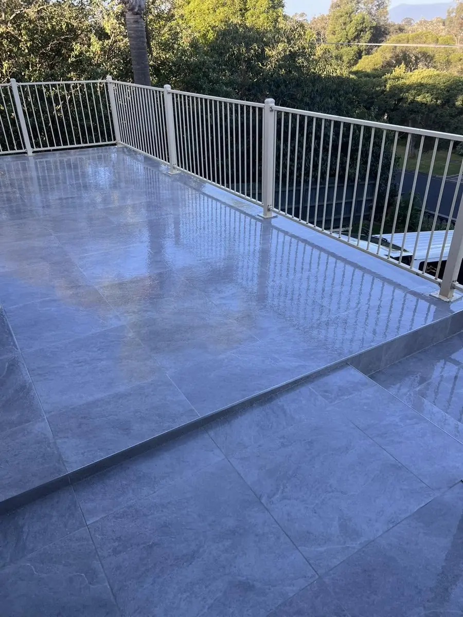 Glossy grey porcelain balcony with white balustrade