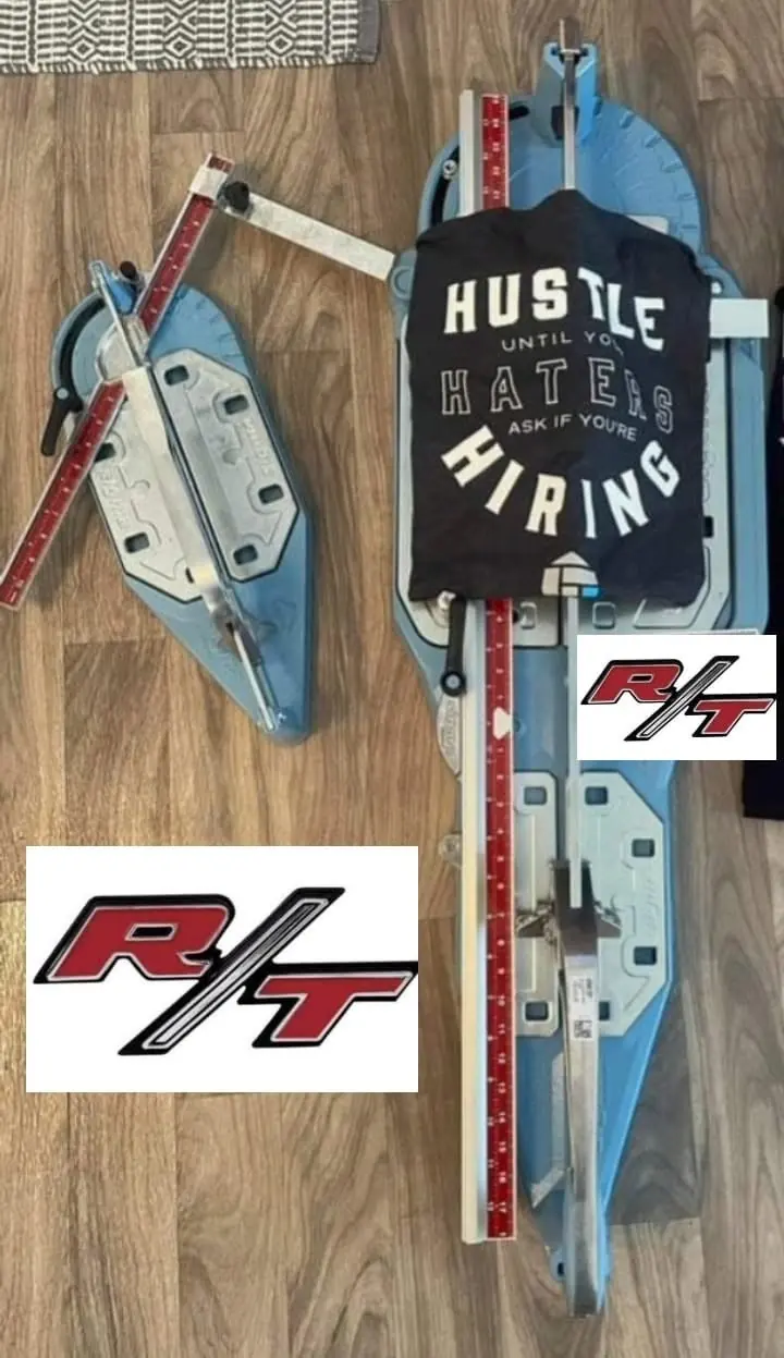 R.T. Tiling's tile cutters with R/T badge stickers on the timber floor