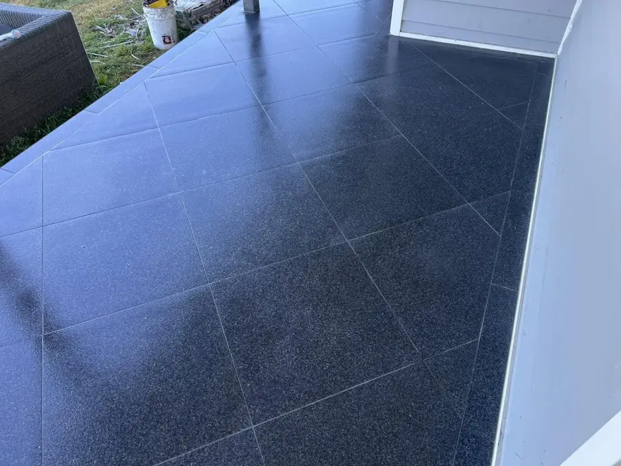 Speckled charcoal verandah tiles in the morning sun