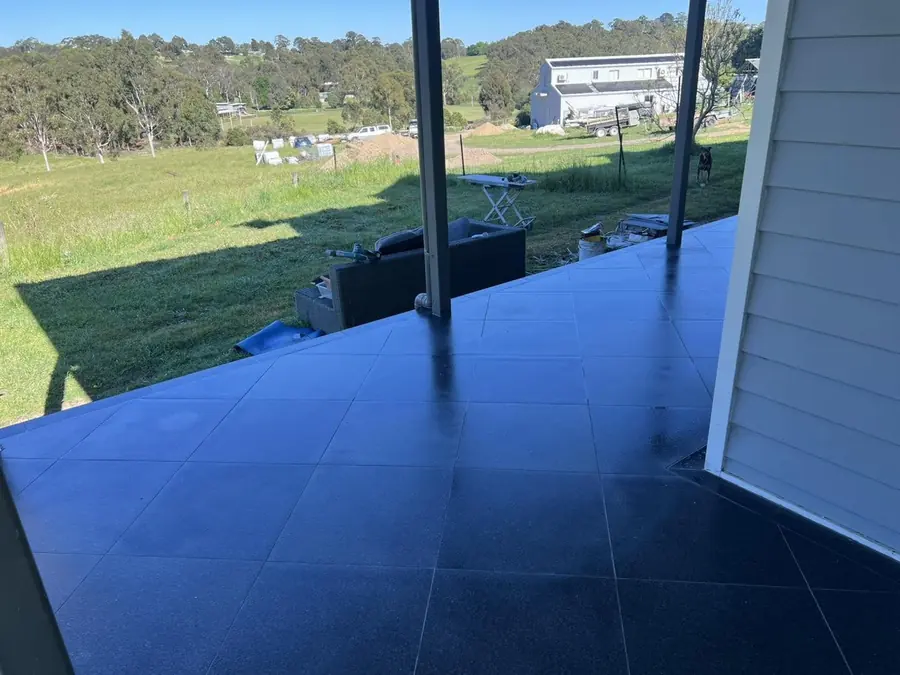 Charcoal verandah tiles looking out over open paddocks